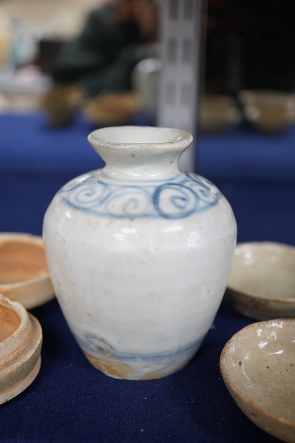 A group of Thai or Annamese miniature pottery vessels and a small blue and white vase, vase 9.5cm high. Condition - poor, fair and good